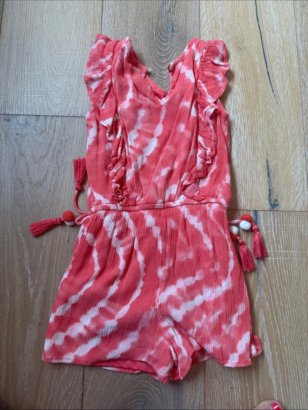 Justice Coral and White Tie-Dye Romper with Ruffle Shoulders